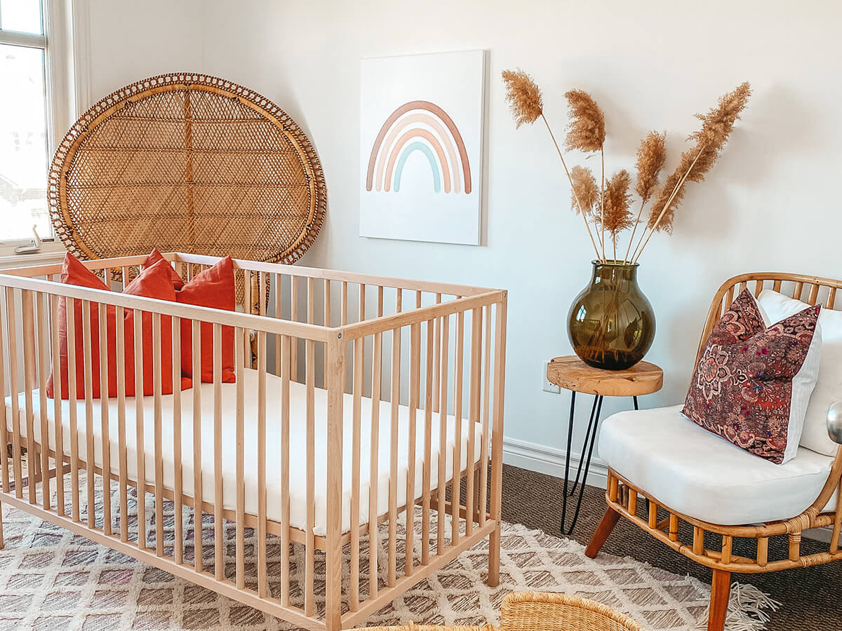A canvas print above a baby's crib