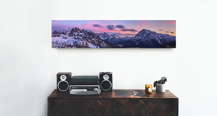 A panoramic canvas print displayed over a credenza.